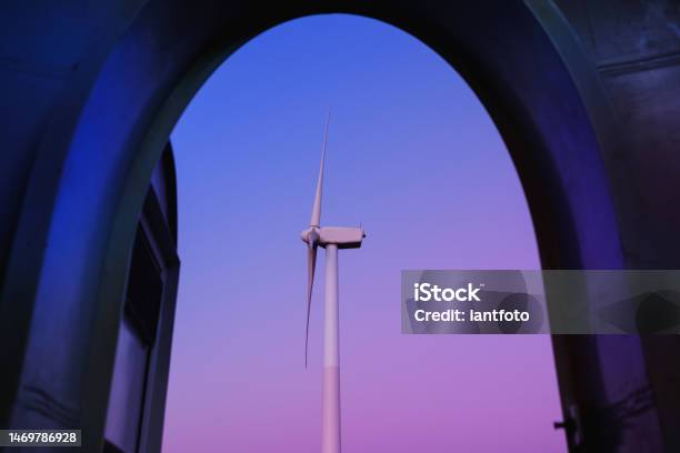 Open The Door To The Wind Turbine In A Purple And Blue Twilight Stock Photo - Download Image Now