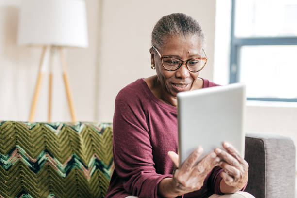 istock Senior women at home using tablet 1469787271