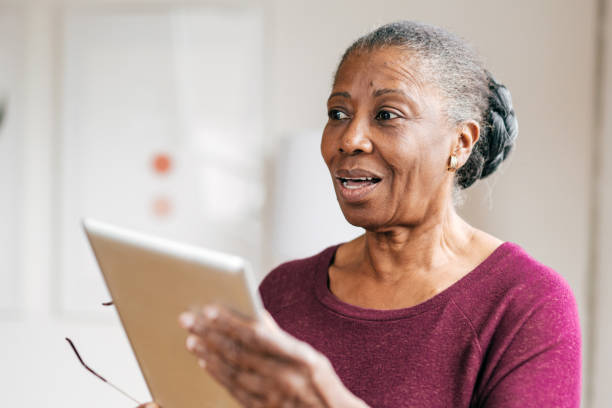 istock Senior women at home using tablet 1469787294