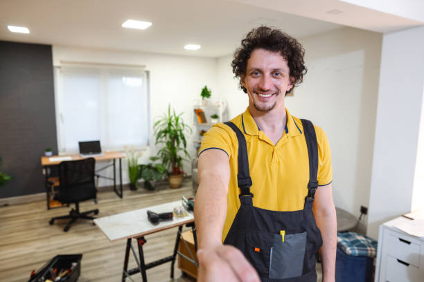 istock Craftsman shaking hands with home owner after successfully finished work 1469787319