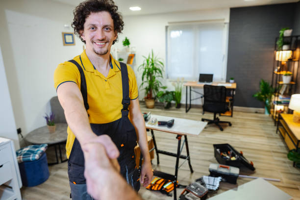 istock Craftsman shaking hands with home owner after successfully finished work 1469787332