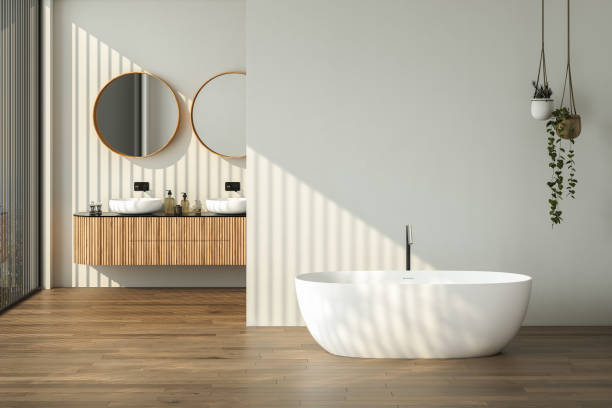 istock Modern bathroom interior with dark brown parquet floor, two sinks, double mirrors, white bathtub, interior plants. Minimalist bathroom with modern furniture and city view. 3D rendering 1469789986