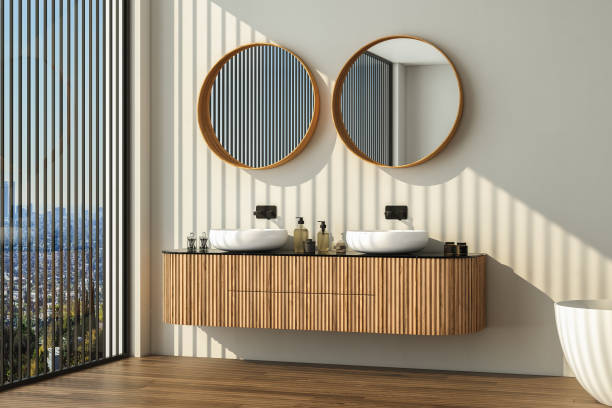 istock Modern bathroom interior with dark brown parquet floor, two sinks, double mirrors, white bathtub, interior plants. Minimalist bathroom with modern furniture and city view. 3D rendering 1469790047