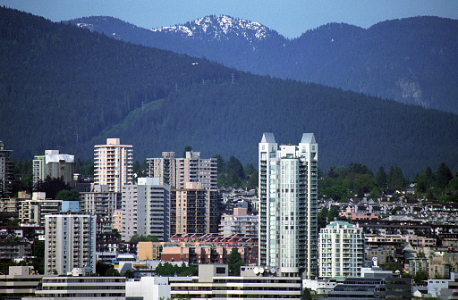 Vancouver, Canada - 2001: A vintage 2000's's Canon negative film scan of the cold pacific ocean and Vancouver bay with skyline and mountains in the distance.