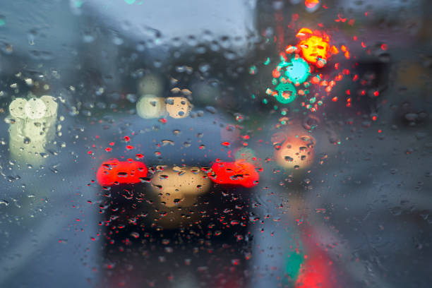 istock Driving in the rain. Drops on the windshield. Wet road. 1469791202