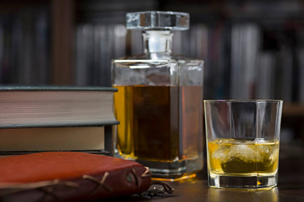 istock Ready to write, a glass of whiskey and some books 1469794369