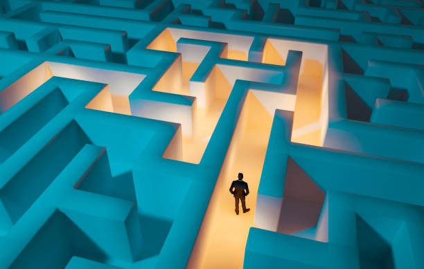 istock Man trapped in a maze is looking for a solution 1469795495