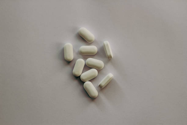 istock Medicine capsules on white background 1469796452