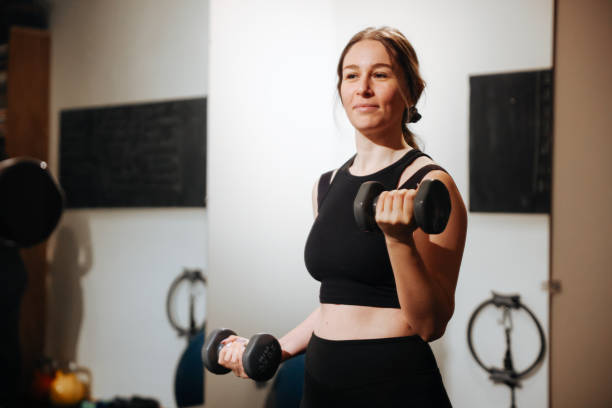 istock Young fitness woman doing exercise at home studio 1469796778