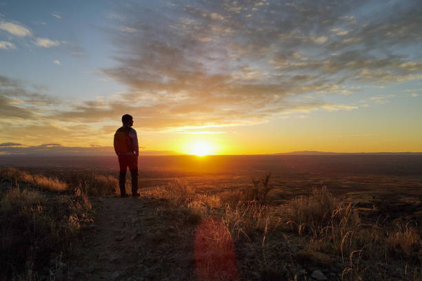 hiking middle aged man majestic mountain sunset stock photo