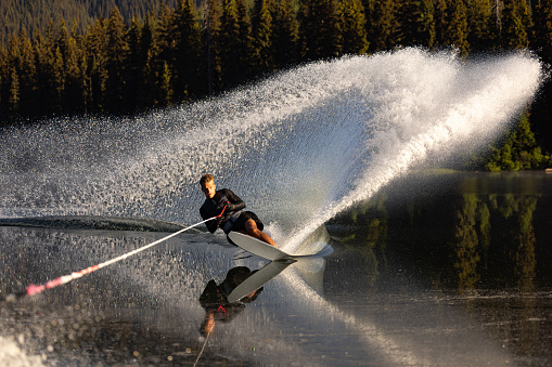 Water skiing on smooth lake