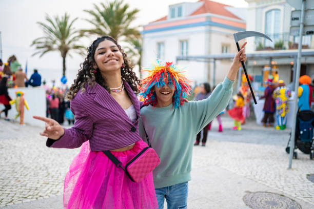 Children having fun in Carnival in Sesimbra Children wearing costumes and having fun at the street carnival 12 17 months stock pictures, royalty-free photos & images