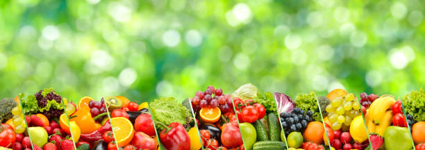 istock Berries, fruits and vegetables on green background. 1469806788