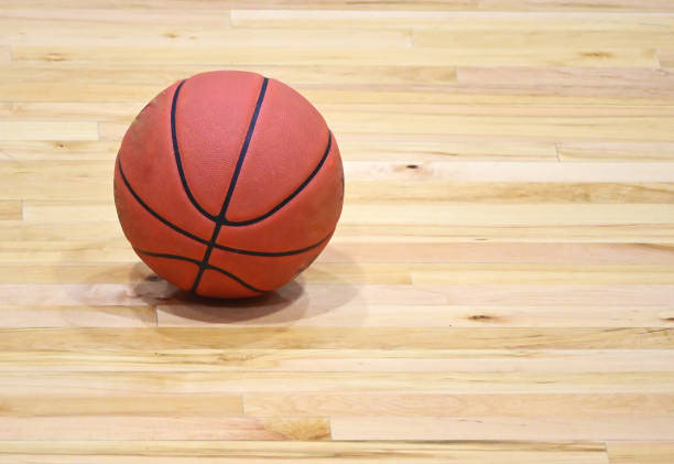 istock Basketball on Hardwood Floor 1469808890
