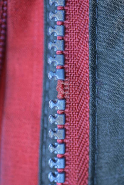 istock broken plastic zip on red green clothing fabric 1469809717