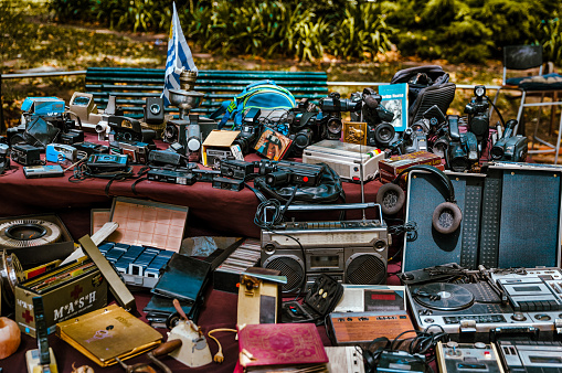 Montevideo, Uruguay - December 22, 2022: A grouping of vintage tech devices on display at a flea market in the old town of Montevideo, capital of Uruguay