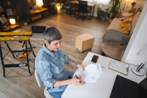 istock Woman looking at the instruction manual 1469815901