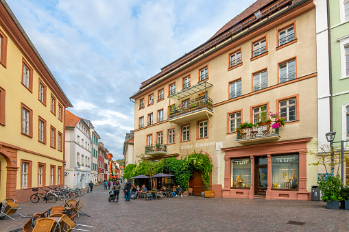 Colorful buildings of apartments, shops and cafes at Heumarkt Square in the old town Altstadt of Heidelberg Germany.