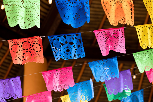 Cut paper or papel picado, hangs from rafters