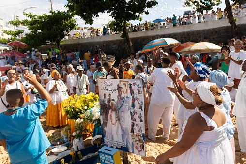 Salvador, Bahia, Brazil - February 02, 2023: Candomble members are seen paying homage to Yemanja during the Rio Vermelho beach party in Salvador, Bahia.