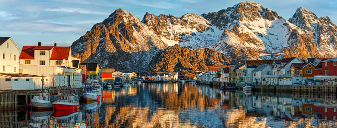 The beautiful small town of Henningsvaer, eagerly visited by tourists in a large panorama on the Lofoten, Norway