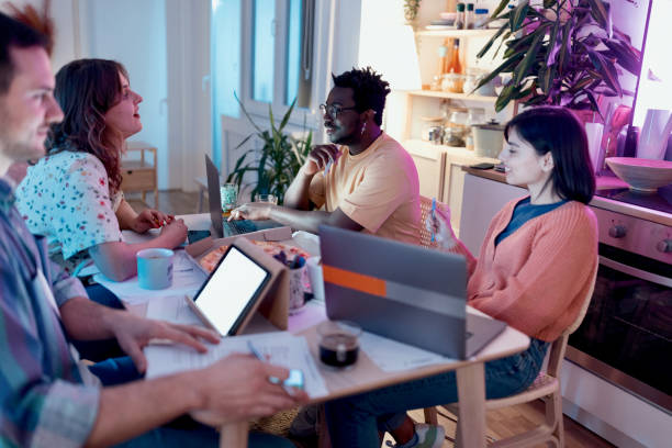 istock Group of students sitting at the table 1469827193