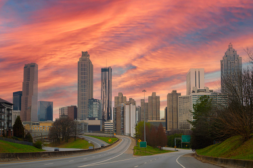 Atlanta City skyline with skyscrapers, buildings, and clouds over the highway in the Capital of the U.S. State of Georgia