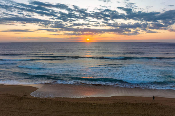 istock Sunrise at the seaside with clouds 1469828829