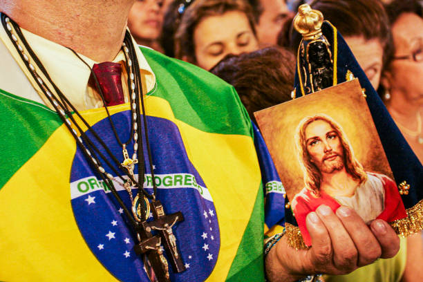 Men holding Jesus's image during religious celebration at Cathedral Basilica of the National Shrine of Our Lady Aparecida - Brazil