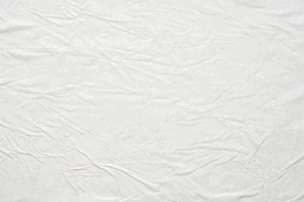 istock white crumpled and creased paper poster texture background 1469841277