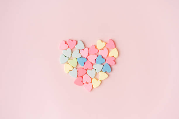 istock Heart shape from small hearts on pink background 1469841519