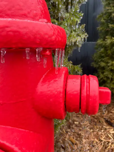 Photo of Ice frozen onto a Red Fire Hydrant