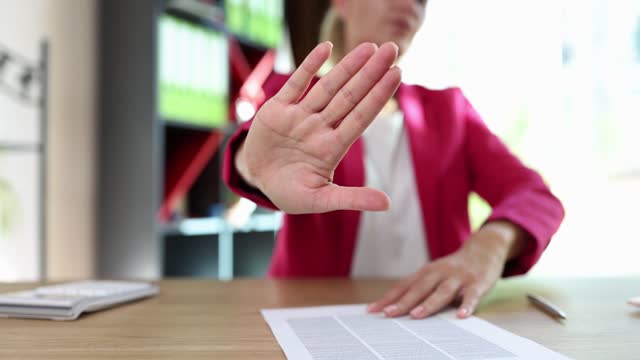 Business woman rejects document for signing in office