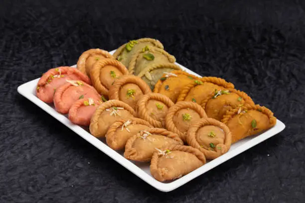 Various Indian Sweet Dumpling Mithai - Rose Gujiya, Karanji, Chandrakala, Suryakala, Kesar Gujia, Thandai Pedakiya Also Called Pirukiya, Pirukia, Basundi, Gughra For Deepawali, Teez Holi, Diwali, Teej