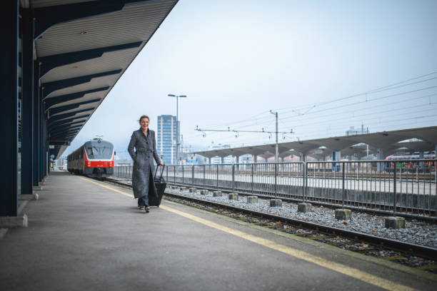 istock Business Woman At Railway Station 1469850193
