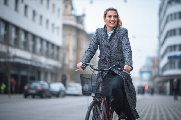 istock Young Businesswoman Heading To Work On A Bicycle 1469850231