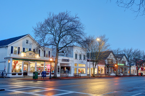 Southampton, New York, USA - February 8, 2023: Morning view of shops and boutiques along Main Street in the downtown district.