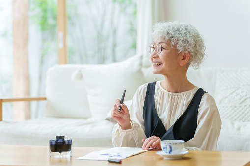 https://media.istockphoto.com/id/1469859968/photo/senior-asian-woman-doing-calligraphy-in-a-living-room.jpg?b=1&s=170667a&w=0&k=20&c=QLTx3ve3X-yggg6l7TT0abH0Ag_TOFdsBZUhz4CzY90=