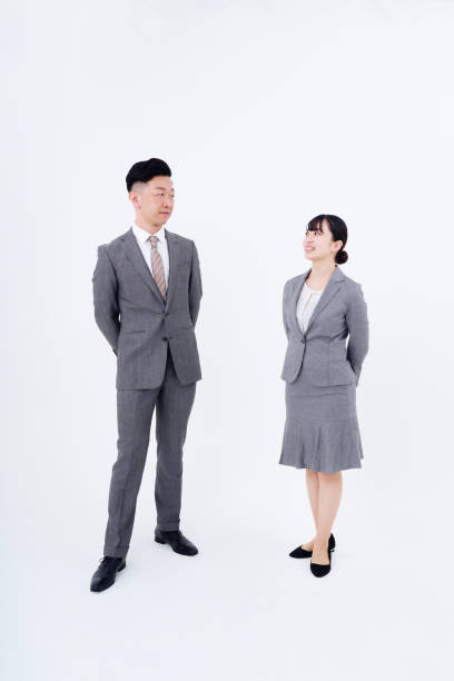 istock man and woman in suits 1469864001