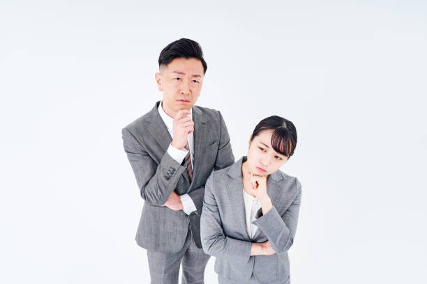 istock A man and woman in a suit who poses a question 1469866268