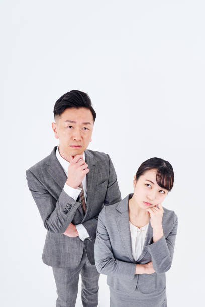 istock A man and woman in a suit who poses a question 1469867226