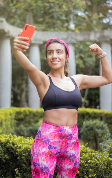 istock After workout: Active woman taking a selfie in the park 1469867326