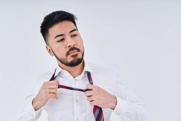 istock Business man adjusting his tie 1469867541