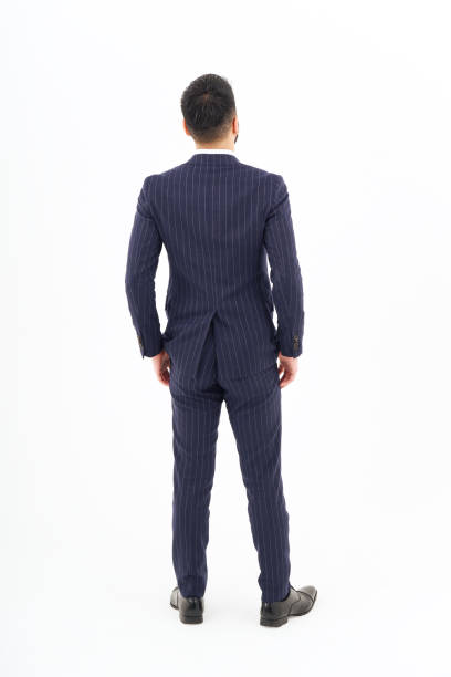 istock Back view of a man in a suit standing 1469869048