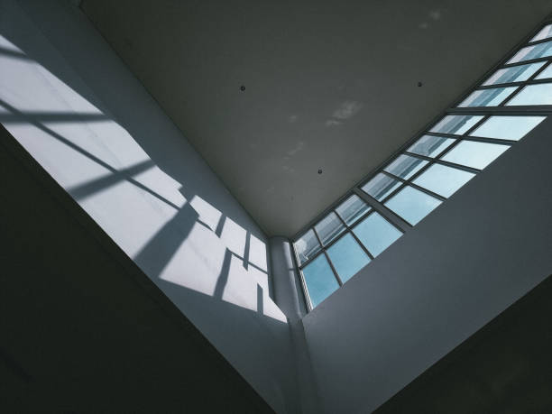 istock Auditorium interior with white wall and the sunlight shining trough the window 1469872461