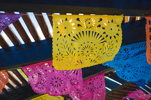 Cut paper or papel picado, hangs from rafters