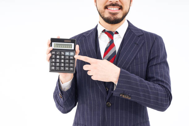 istock A man in a suit with a calculator 1469879277