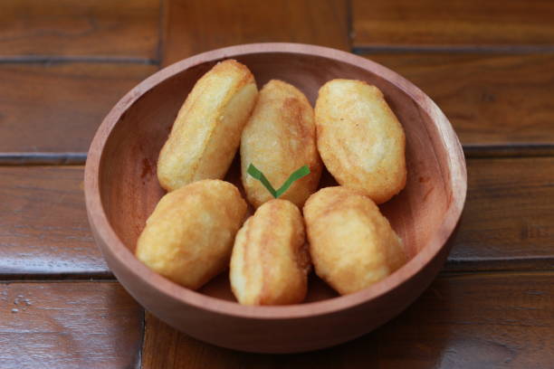 istock Comro or combro, a traditional Javanese snack made of deep fried grated cassava filled with a savory mix of oncom or fermented soy bean cake and chili 1469880753