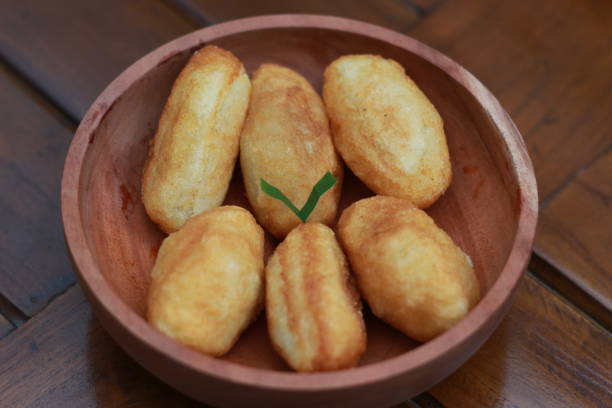 istock Comro or combro, a traditional Javanese snack made of deep fried grated cassava filled with a savory mix of oncom or fermented soy bean cake and chili 1469881293