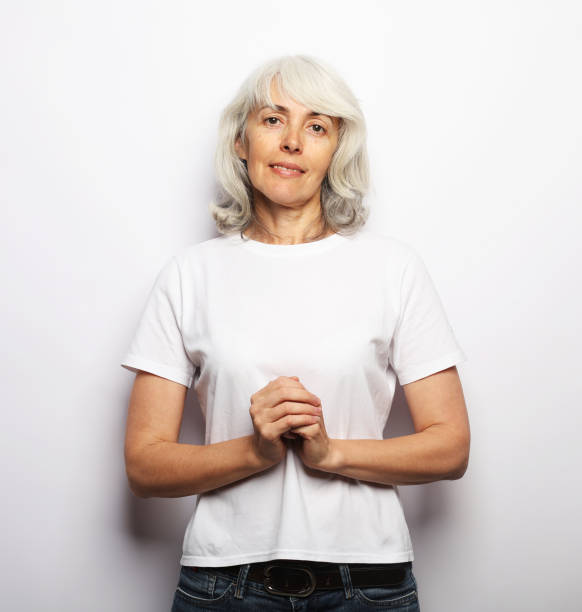 istock Happy elderly female smiling over white background, close up 1469881620